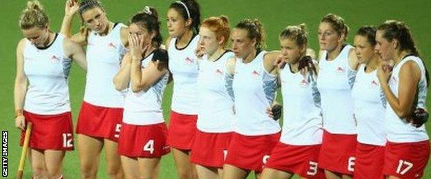 England's dejected players after losing the Commonwealth Games shoot-out