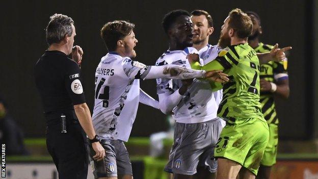 Players clash in the game between Forest Green Rovers and Colchester United