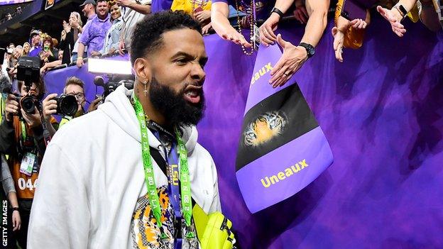 Cleveland Browns wide receiver Odell Beckham Jr walks past LSU fans at the College Football Championship game