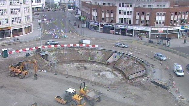 One of the roundabouts with underpasses was filled in to accommodate the bendy bus