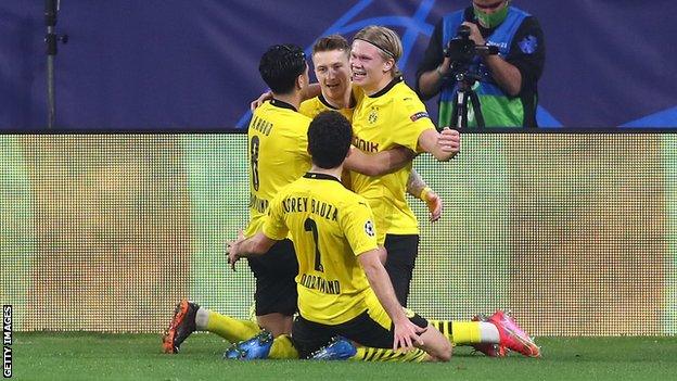 Erling Braut Haaland (right) celebrates with team-mates after scoring against Sevilla