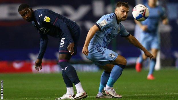 Marc Guehi (left) and Matty Godden battle for possession