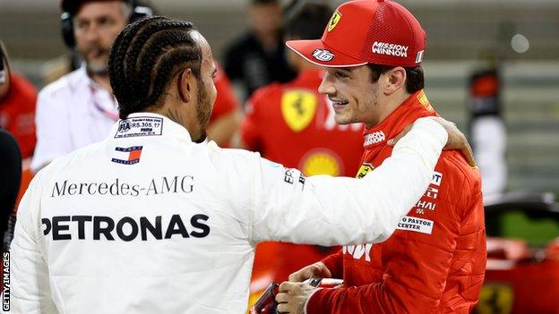 Charles Leclerc is congratulated by Lewis Hamilton after securing pole position at the Bahrain GP