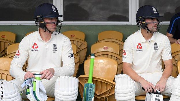 England openers Keaton Jennings (left) and Rory Burns (right) look on while waiting to bat in a warm-up game in the West Indies