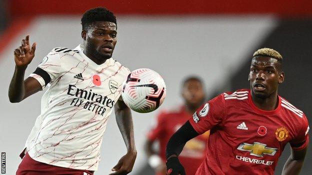 Arsenal's Thomas Partey and Manchester United's Paul Pogba