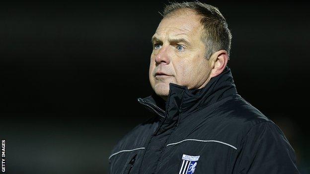 Gillingham manager Steve Lovell looks on from the dugout