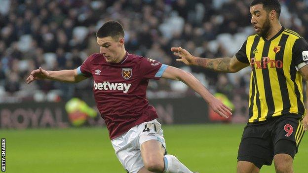 West Ham's Declan Rice evades a challenge from Troy Deeney of Watford