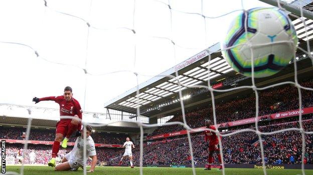 Roberto Firmino scores his second goal in Liverpool's 4-2 win over Burnley on 10 March