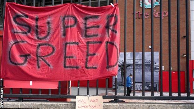 A sign hung outside Liverpool's Anfield stadium reads 'Super Greed' as part of protests against a proposed European Super League