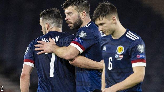 Grant Hanley (centre) won't face Moldova or Denmark but Kieran Tierney should be fit