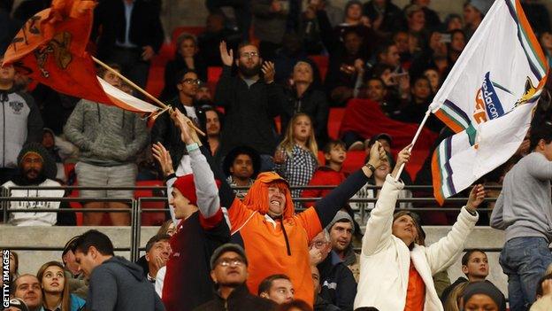 Southern Kings and Cheetahs fans wave banners at their final Super Rugby match