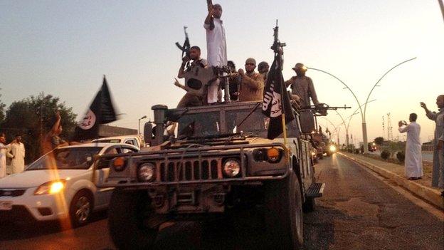 ISIS in commandeered Iraqi vehicle, Mosul, June 2014