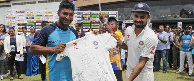 Kumar Sangakkara was presented with a signed shirt by India captain Virat Kohli