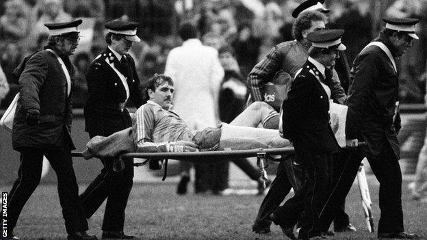 Neville Southall is stretchered off in 1986