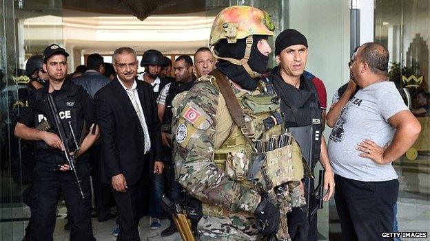 Tunisian security forces stand in front of the Imperial hotel in the resort town of Sousse