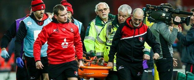 Billy Burns leaves field on stretcher