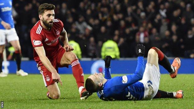 Aberdeen captain Graeme Shinnie fouls Rangers' Ryan Kent