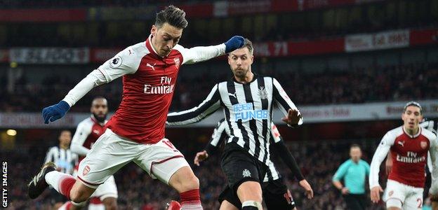 Mesut Ozil in action for Arsenal