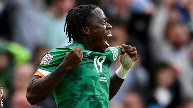 Obafemi celebrates his goal against Scotland