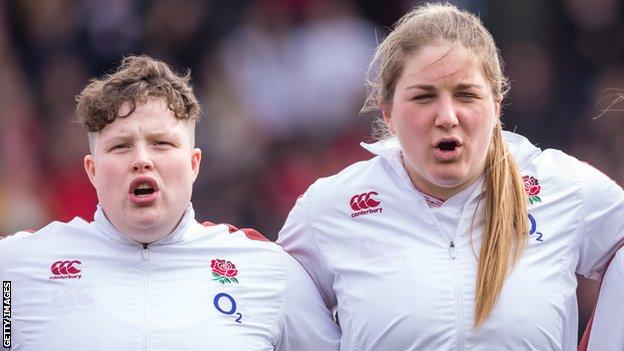 Hannah Botterman and Poppy Cleall singing the anthem