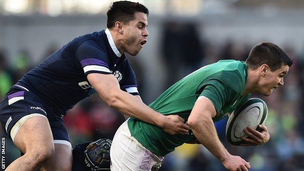 Scotland wing Sean Maitland tackles Ireland fly-half Jonny Sexton