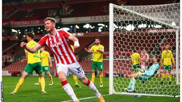 Nathan Collins celebrates after scoring for Stoke against Norwich City