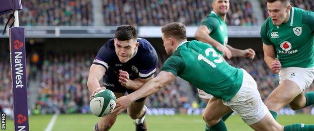 Blair Kinghorn scores Scotland's try despite the efforts of Garry Ringrose