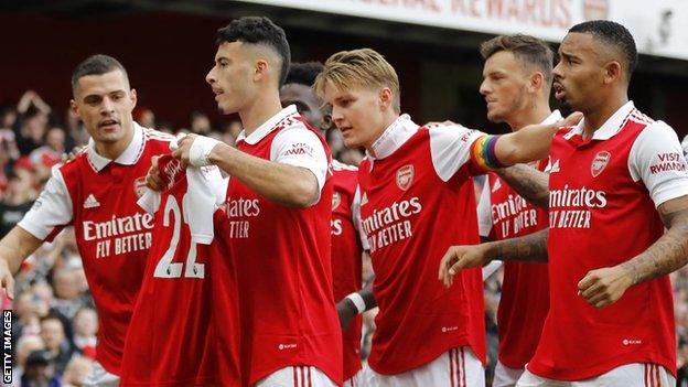 Martinelli holds up Mari's shirt after scoring