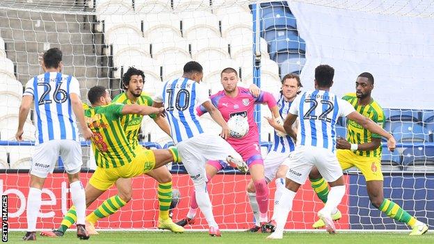 Chris Willock scores for Huddersfield against West Brom