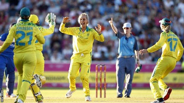 Australia's Ash Gardner, centre, celebrates during the gold medal match against India