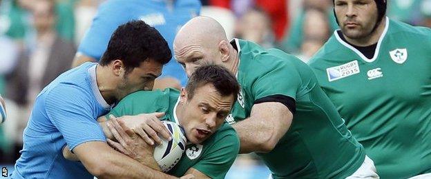 Ireland winger Tommy Bowe is tackled during the World Cup Pool D game against Italy