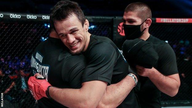 Usman Nurmagomedov celebrates his win over Finland's Patrik Pietila - with his cousin, former UFC lightweight champion Khabib Nurmagomedov, on the right