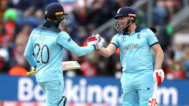 Jason Roy and Jonny Bairstow shake hands in the middle while batting for England