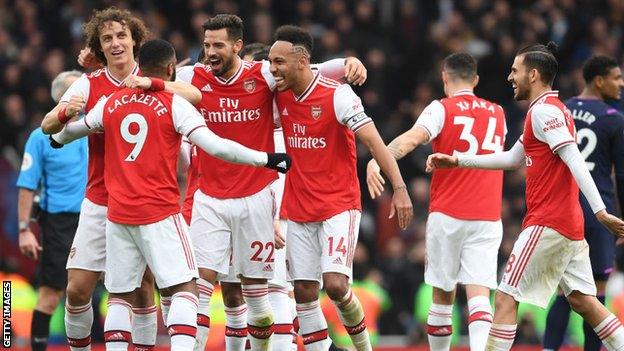 Arsenal players celebrate a goal