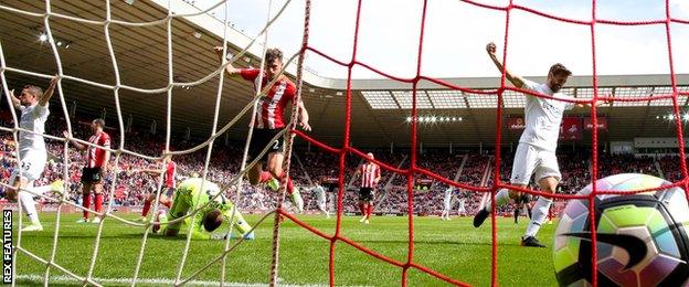 The ball rests in the net after Kyle Naughton scores