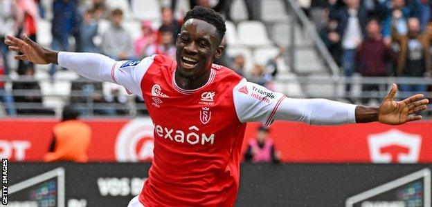 Folarin Balogun celebrates a goal for Reims