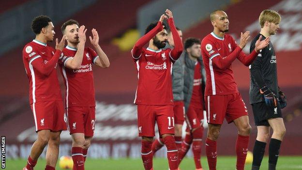 Liverpool's players applaud the fans at the final whistle against Wolves