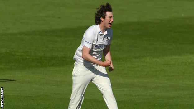 Bowler Jamie Atkins celebrates taking a wicket