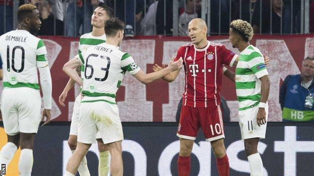 Celtic players shake hands with Arjen Robben at full-time