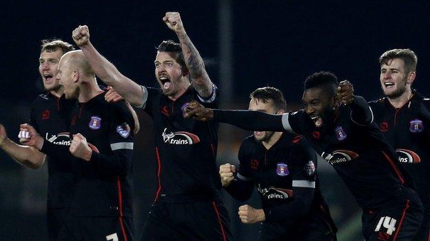 Carlisle players celebrate winning a penalty shoot-out against Yeovil