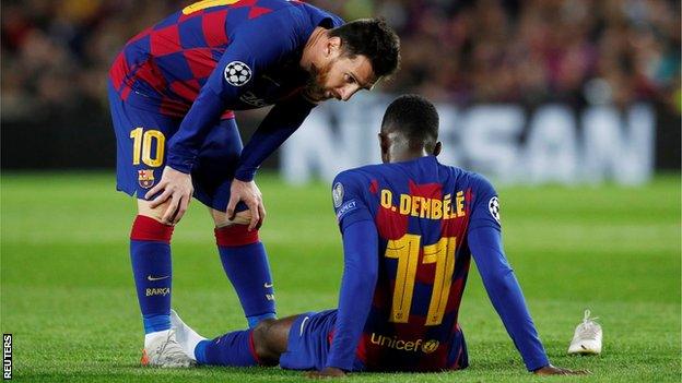 Injured Ousmane Dembele consoled by Lionel Messi