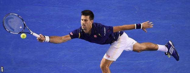 Novak Djokovic stretches for a forehand