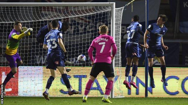 Wycombe's Uche Ikpeazu scores an own goal to put Derby County ahead