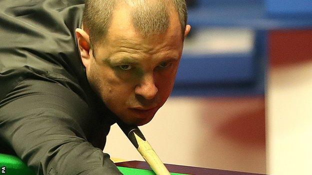 Barry Hawkins plays a shot