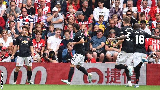 Daniel James (left) celebrates scoring