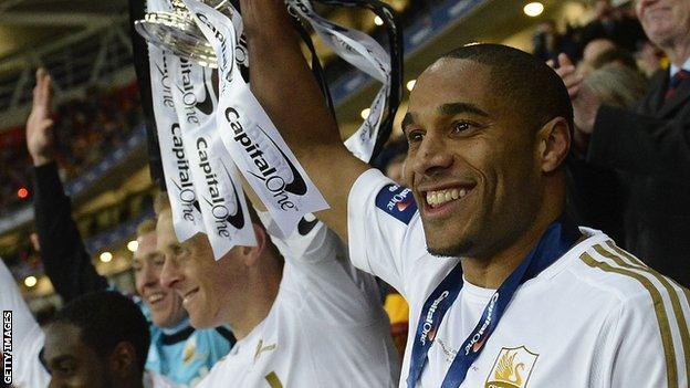 Ashley Williams lifts the League Cup in 2013