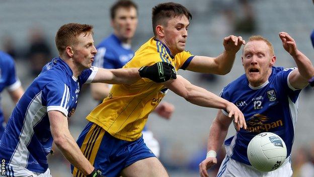 Cavan pair Jason McLoughlin and Cian Mackey challenge Roscommon's Brian Stack