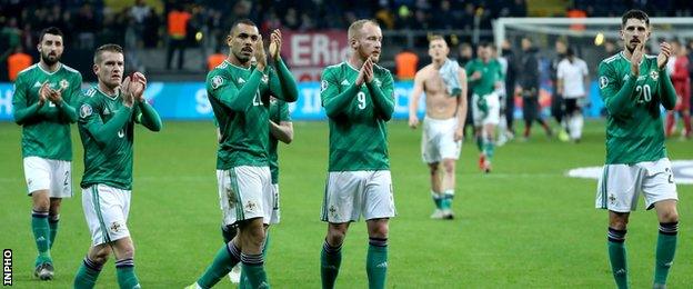 Northern Ireland's team applaud fans after the game