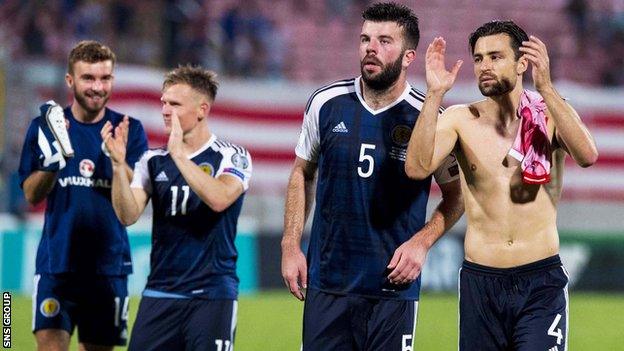 Scotland players applaud the Tartan Army at full-time