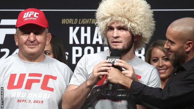 Khabib Nurmagomedov and his father and coach Abdulmanap Nurmagomedov at a weigh-in ceremony before his fight with Dustin Poirier at UFC 242